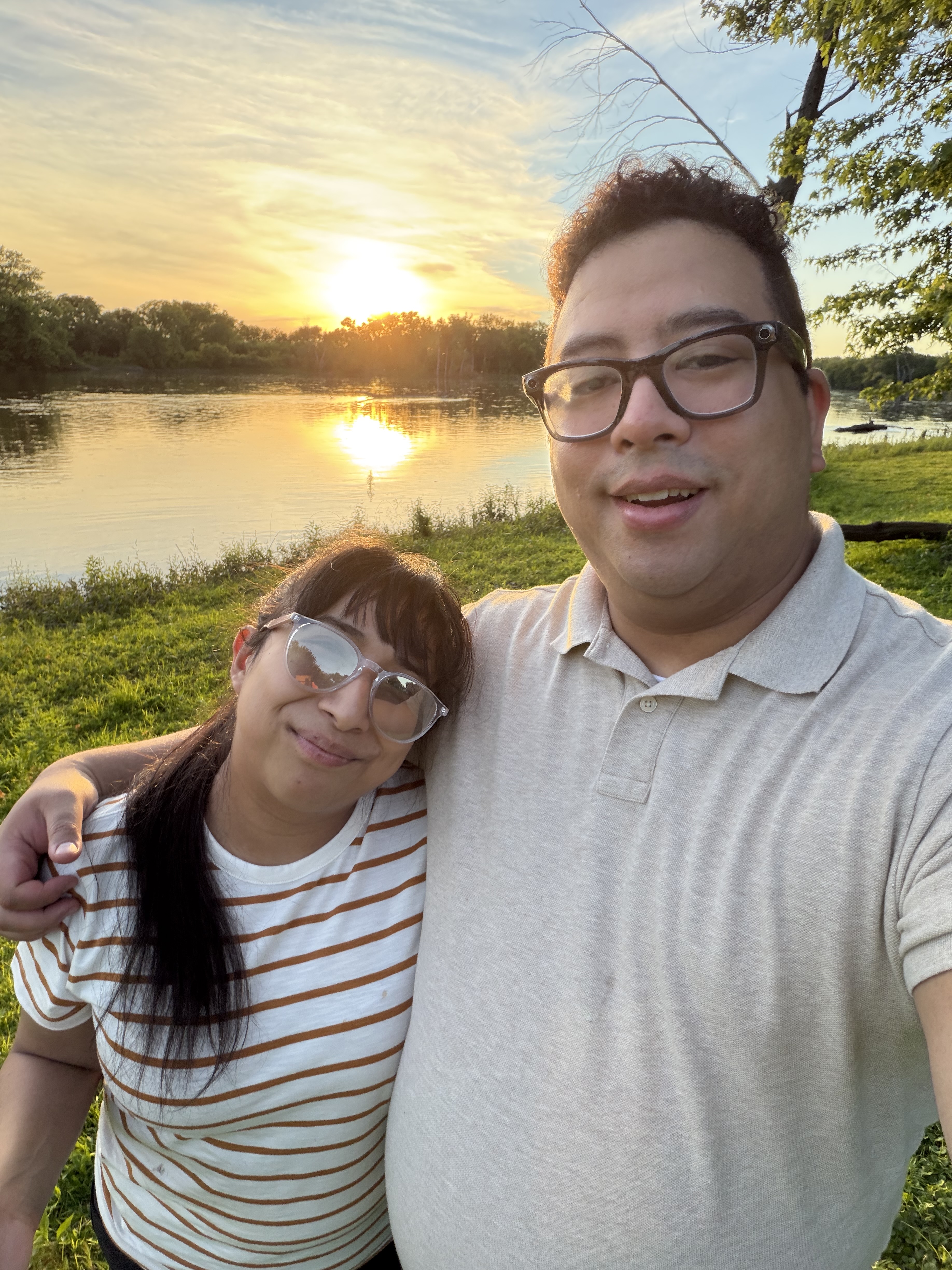 David and his wife by the water at sunset